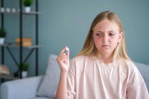The child does not want to take medication Stock Photos