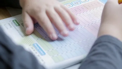 Child doing his homework. Slow motion. Stock Footage 83817231