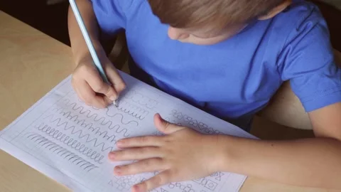 Child doing his homework. View from above Stock Footage 141598336
