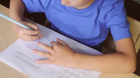 Child doing his homework. View from above Stock Footage 143441787
