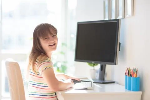 Child doing homework on computer. Online class. Stock Photos