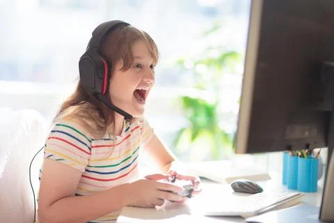 Child doing homework on computer. Online class. Stock Photos