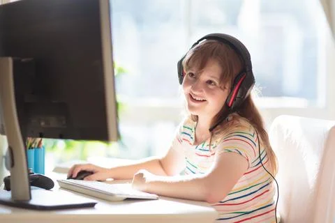 Child doing homework on computer. Online class. Foto stock
