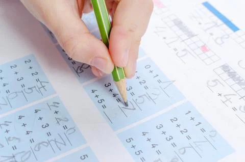 Child is doing homework, math, close up Stock Photos