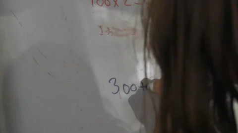 Child Doing Math Problem on Dry Erase Board, 4K Stock Footage 54274275