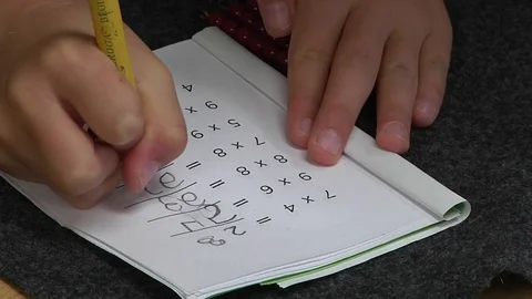 A child doing a mathematics exercise in a Montessori School Class  Stock Footage 83326379