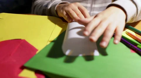 Child doing plane from the white sheet of paper Stock Footage 59992660