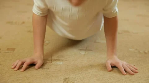 Child Doing Push-Ups Stock Footage