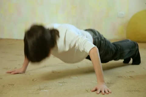 Child Doing Push-Ups Stock Footage