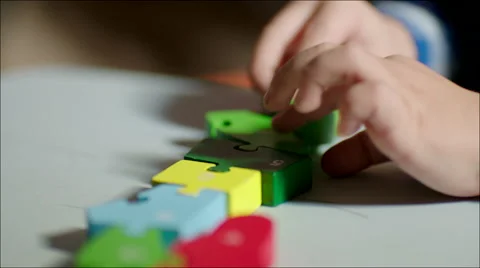 Child Doing Puzzle Closeup Stock Footage 62219335