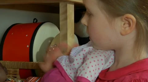 Child with doll Stock Footage 22637056