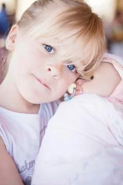 Child with doll Stock Photos