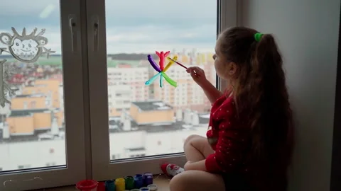 Child draw snowflake in rainbow colours on window with paint Stock Footage 166154163