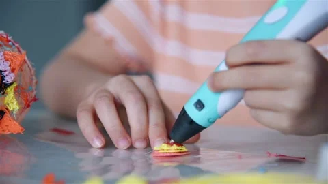 Child drawing with 3d pen close up Stock Footage 331940634