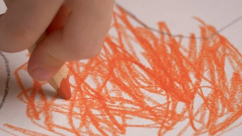 Child is drawing with colored pencils, crayons. Kid is learning to draw. Macro s Stock Footage 127327445