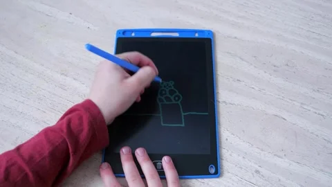 Child drawing on a doodle board in close-up view Stock-Footage 271152666