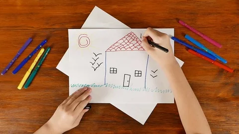 Child is drawing house with markers Stock Footage 70789908
