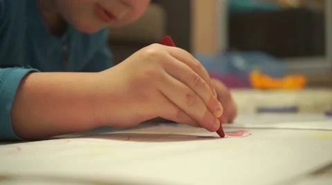 Child drawing with red crayon, close up zoom in video Stock Footage 59951300