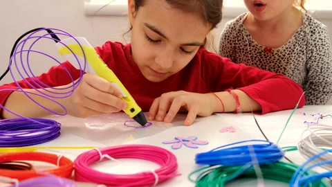 The child draws with a 3D pen. Selective focus. Stock Footage 234608609