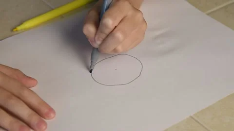 A child draws bitcoin on paper. Stock Footage 145086141