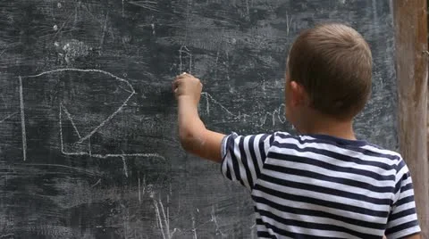 Child draws on a blackboard Stock Footage 11490775