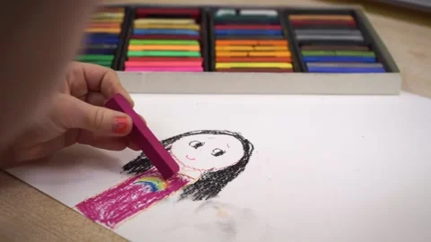 The child draws the defoch with colored crayons Stock Footage 169281306