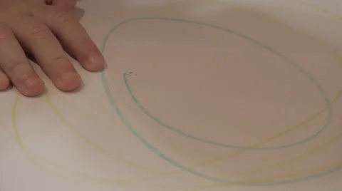 Child draws enthusiastically on notepad 動画素材 42320268