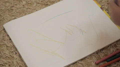 Child draws enthusiastically on notepad Video stock 42320278