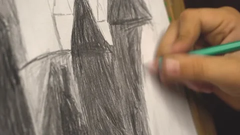 The child draws with hatching. simple pencil drawing Close up painter hand Stock Footage 215563623
