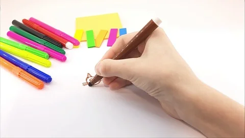 A child draws a kitten on a white sheet Stock Footage 125354579
