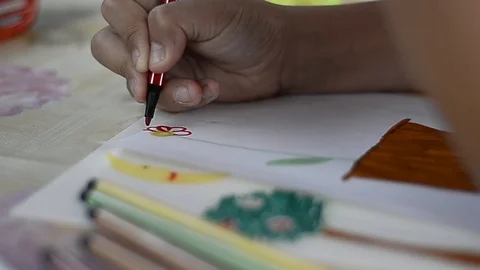 Child draws on a leaf Stock Footage 88957777