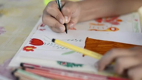 Child draws on a leaf Stock Footage 88958044