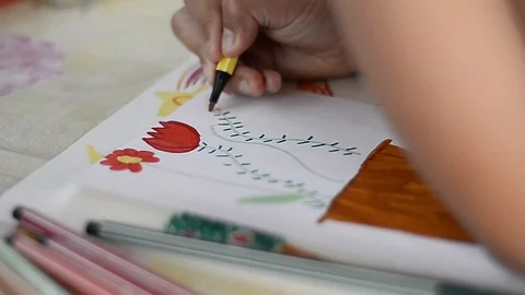 Child draws on a leaf Stock Footage 88958061