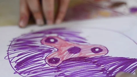 Child draws on a leaf Stock Footage 88958352