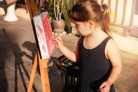 The child draws on a malbert Stock Photos