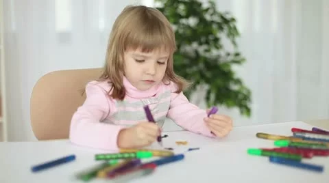 Child draws markers at the table Video stock 8975179