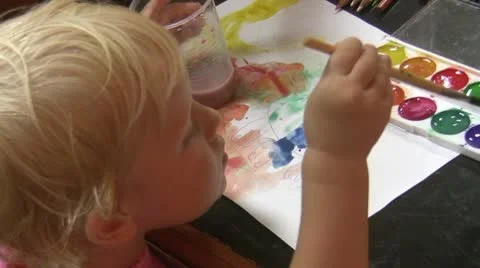 Child draws paint Stock Footage 10576808