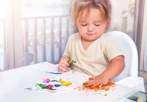 The child draws with paints Stock Photos