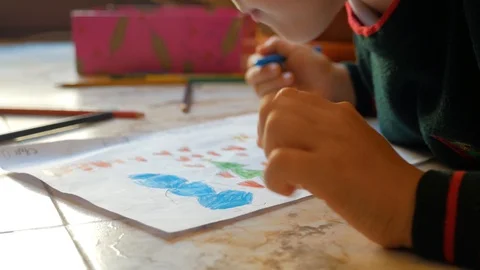 The child draws on paper Stock Footage 86890861