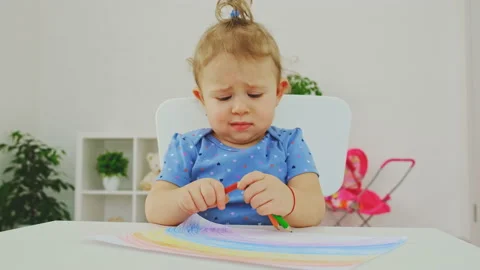 A child draws a rainbow on paper. Selective focus. Stock Footage 194777344