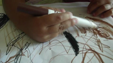Child draws a scribbled lines by marker pen on paper. Child hand drawing Stock Footage 53186628