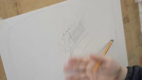Child draws on a sheet with a pencil Stock Footage 160999412