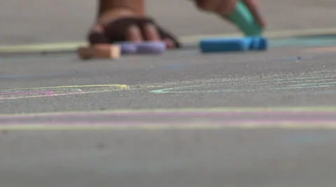 Child draws with sidewalk chalk. Video stock 27949385