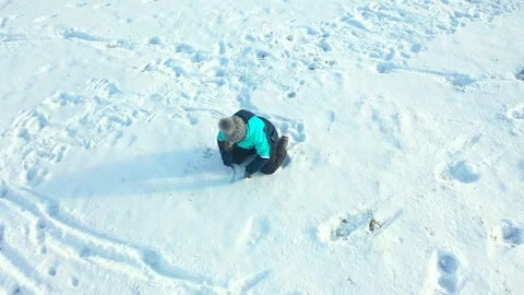 Child draws in the snow Stock Footage 120288926