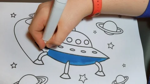 Child draws a spaceship in the space Stock Footage 124200689