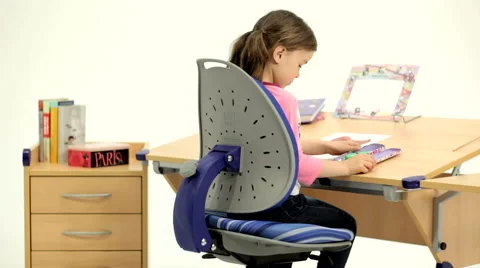 The child draws at the table Stock Footage 49596914