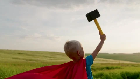 Child dream, kid boy plays mythological god of thunder, lightning, hurricane Stock Footage 240499160