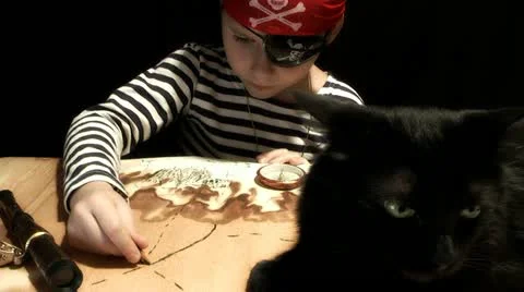 Child dressed as a pirate treasure map drawing Stock Footage 12689640