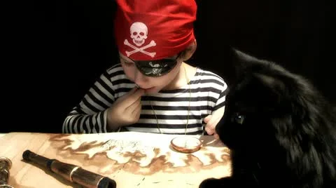 Child dressed as a pirate treasure map drawing Stock Footage 12689641