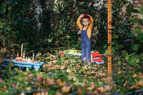 Child dressed as a workman builder. Portrait little builder in hardhats Stock Photos